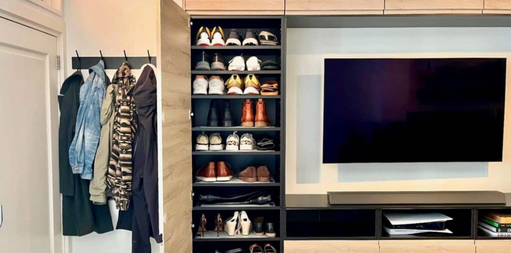 TV wall and entryway shoe storage with IKEA kitchen cabinets