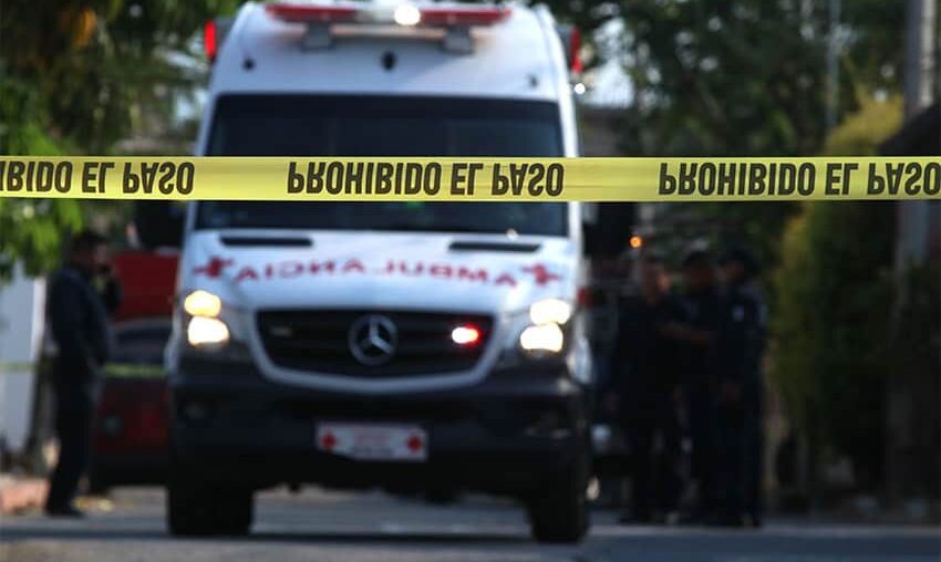 An ambulance rushes to the scene of a homicide.