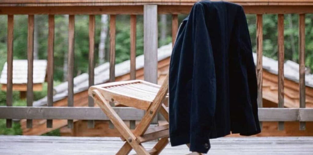 a blue jacket hanging on a chair