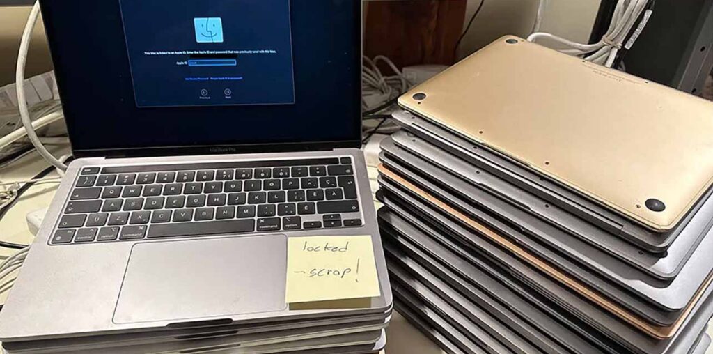 A stack of Activation Locked MacBooks destined for the shredder in refurbisher [John Bumstead]’s workshop.