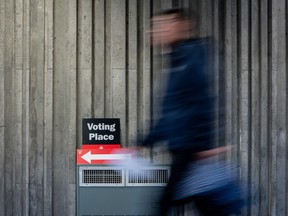 A man walks to a polling station to vote in Vancouver, on Saturday, October 19, 2024.