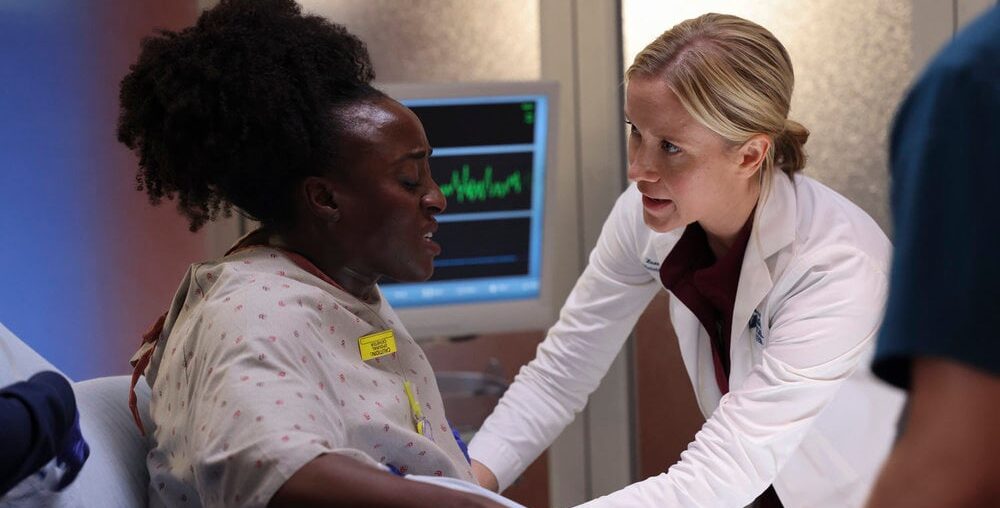 Hannah asking a patient where it hurts on Chicago Med Season 10 Episode 3