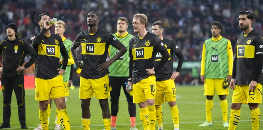 Dortmund slump to 2-1 loss at Augsburg