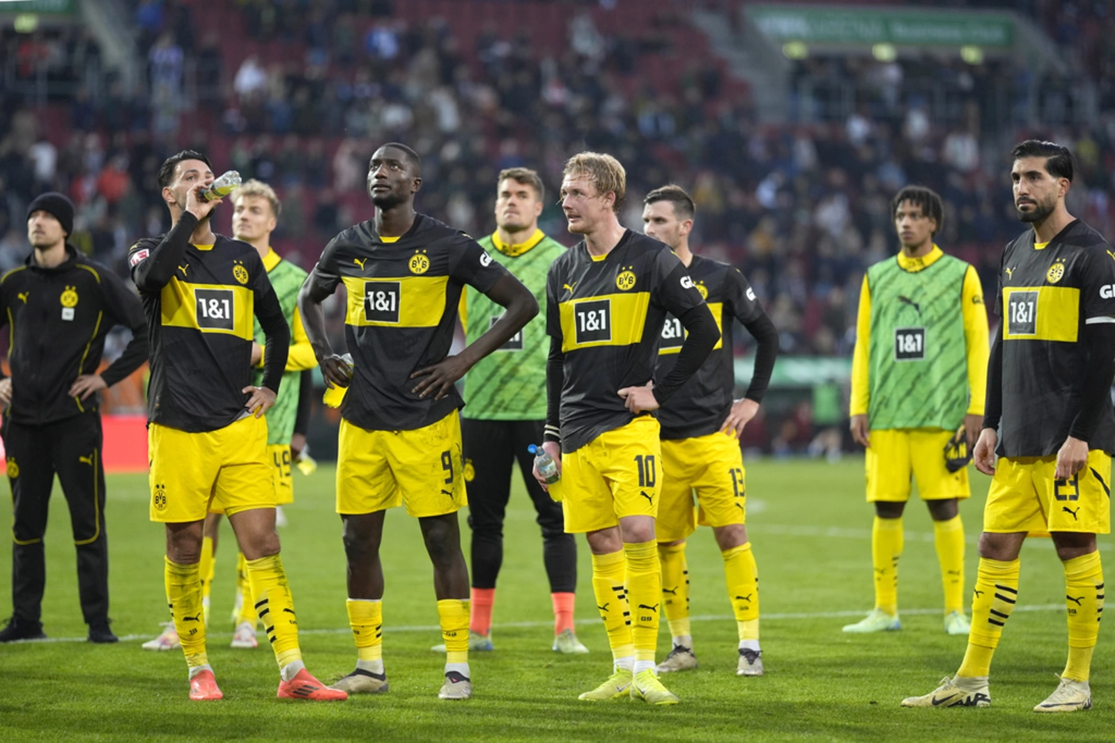 Dortmund slump to 2-1 loss at Augsburg