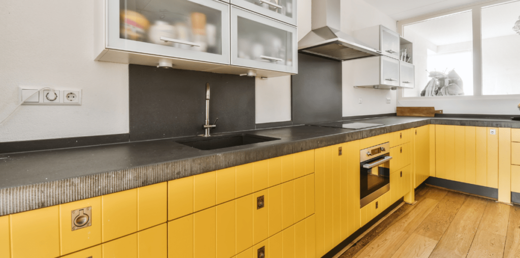 Mustard yellow kitchen cabinets.