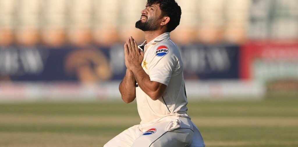 Kamran Ghulam celebrates scoring a century on Test debut