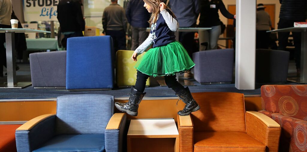 Rylee Mehung, 7, made the best of boredom while waiting for Senator Elizabeth Warren to rally with supporters at Manchester Community College in New Hampshire on Feb. 8.