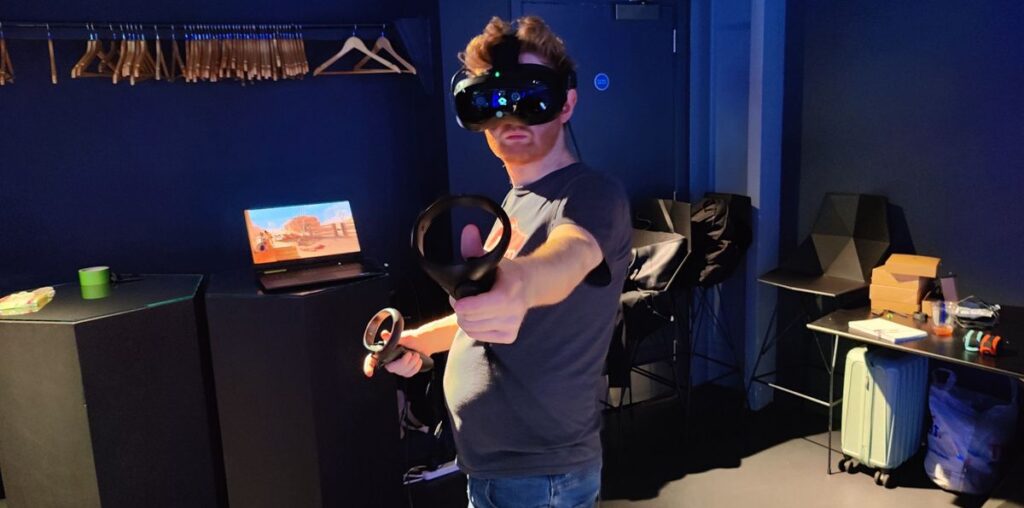 Our writer at the HTC Vive Focus Vision preview event wearing the headset.