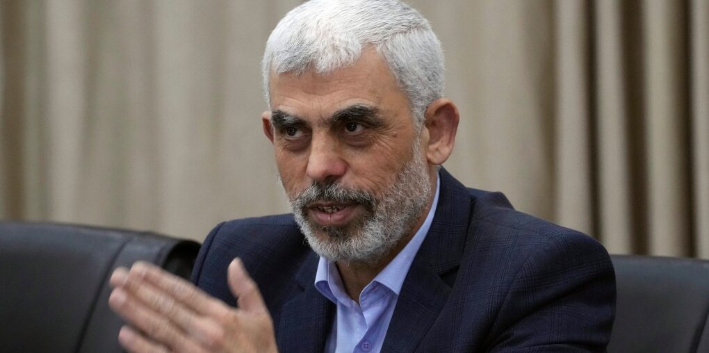 Yehia Sinwar, head of Hamas in Gaza, greets his supporters during a meeting with leaders of Palestinian factions at his office in Gaza City, Wednesday, April 13, 2022.