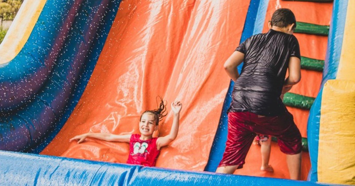 ‘My neighbor had been called in front of a board meeting [and] fined about $1000’: Neighbor snitches on parents who let kids play on water slide bouncy house at all hours and flood other people’s yards