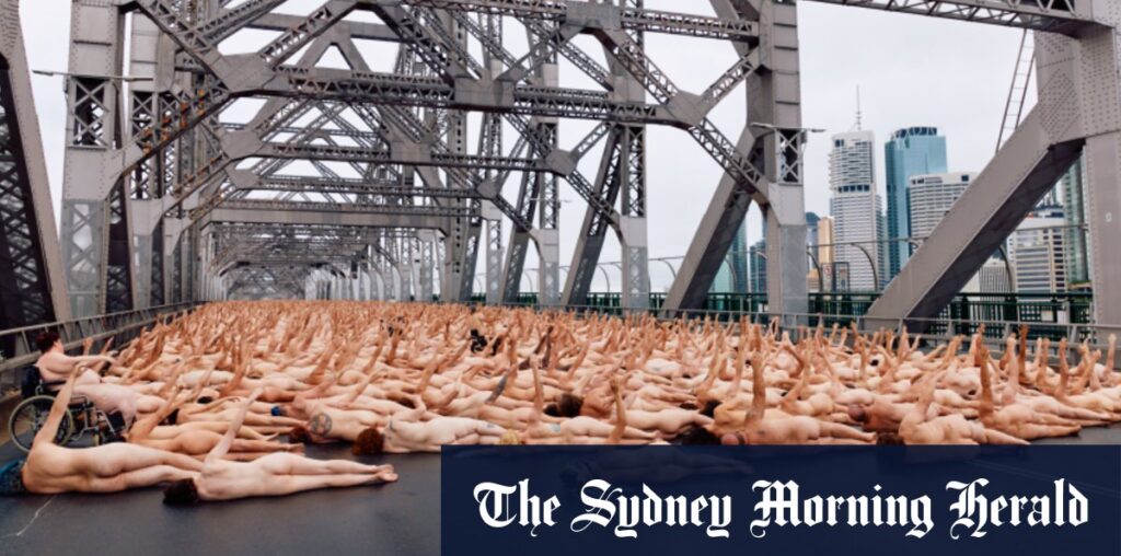 Nude awakening: Thousands flock to Story Bridge for dawn art shoot