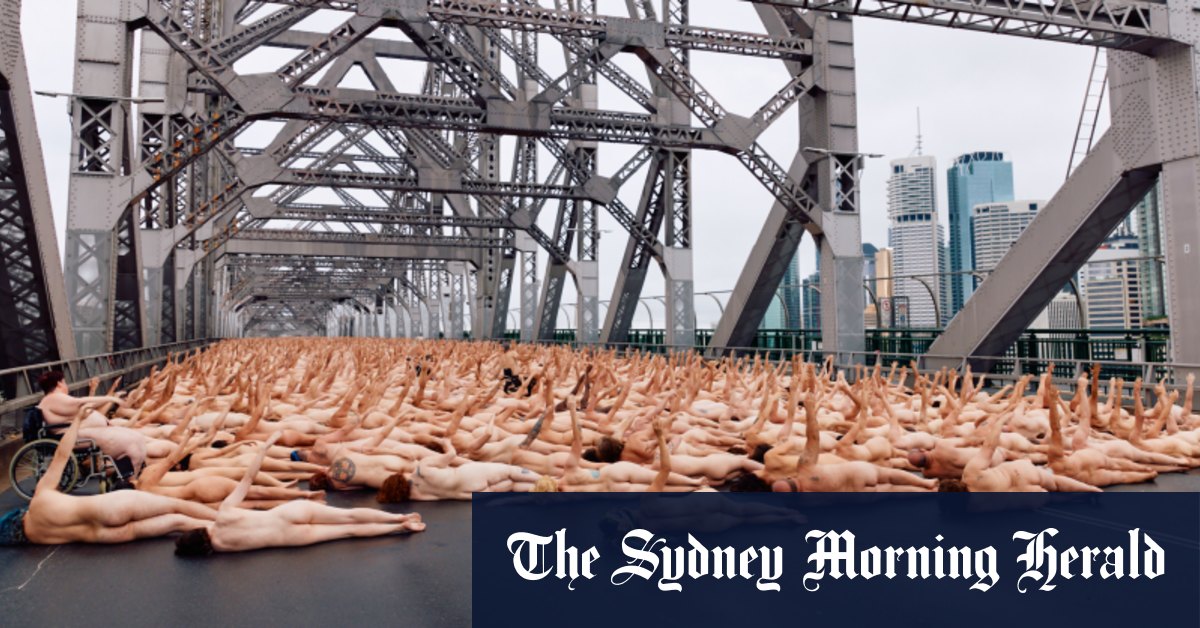 Nude awakening: Thousands flock to Story Bridge for dawn art shoot