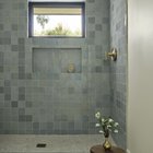 Soft blue zellige tile shower with patterned tile floor in a renovated Encinitas home, San Diego County, California. By Jessica Reynaud Design.