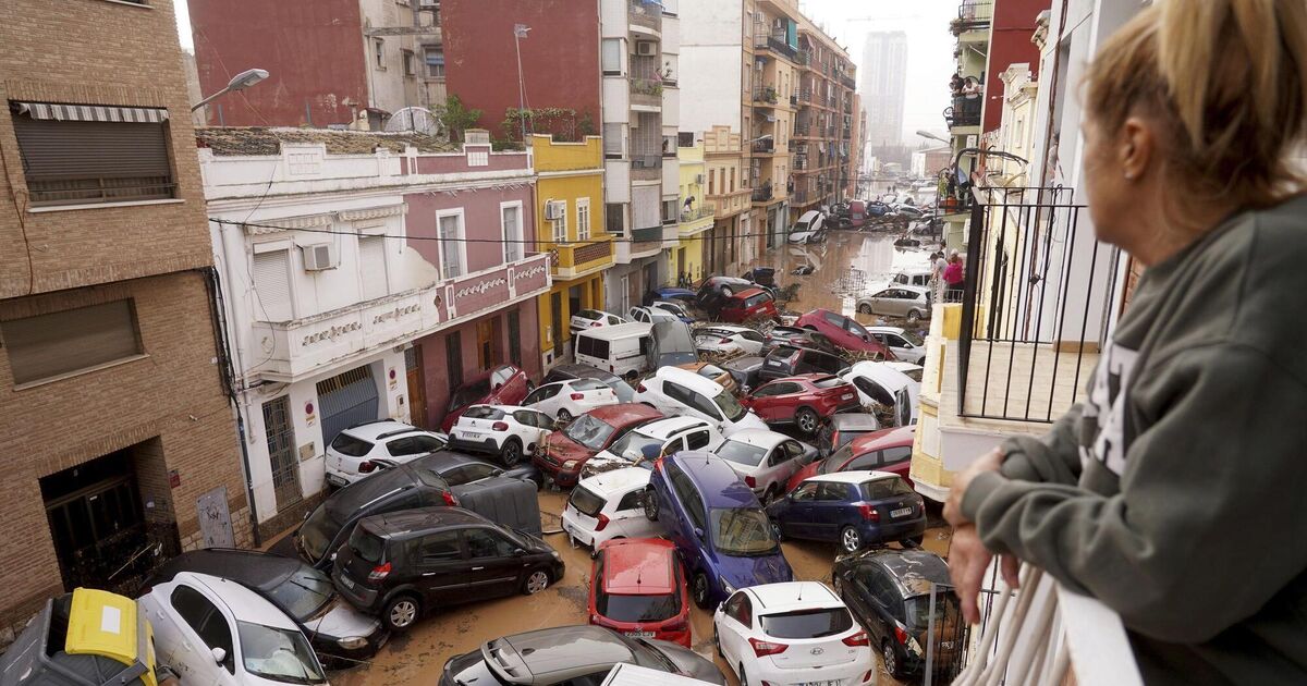 Spain declares three days of mourning as floods kill at least 64 people in Valencia region