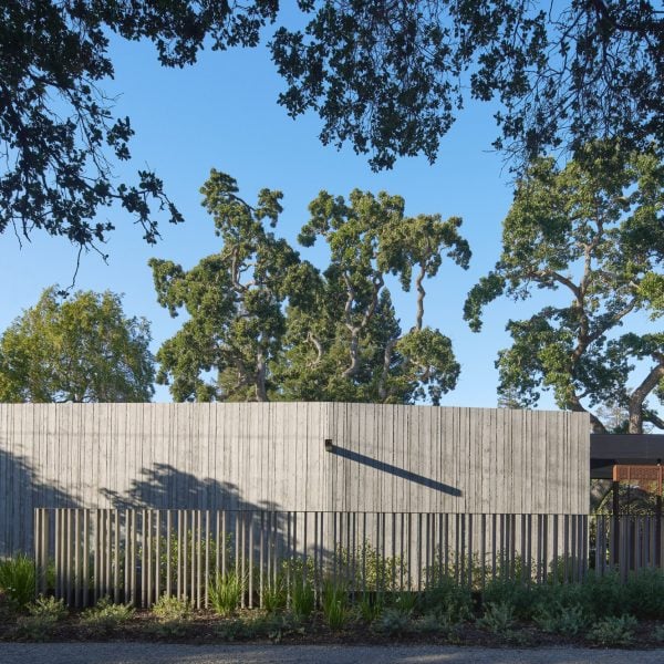 Tall “acoustic wall” buffers noise at Modal Home in Silicon Valley