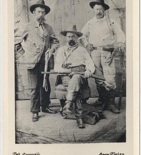 William A. Pinkerton with railroad special agents Pat Connell (left) and Sam Finley (right), full-length portrait]