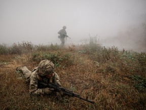 New recruits of the 24th Mechanized Brigade improve their tactical skills on an obstacle course at a training field at an undisclosed location in Donetsk region on October 14, 2024.