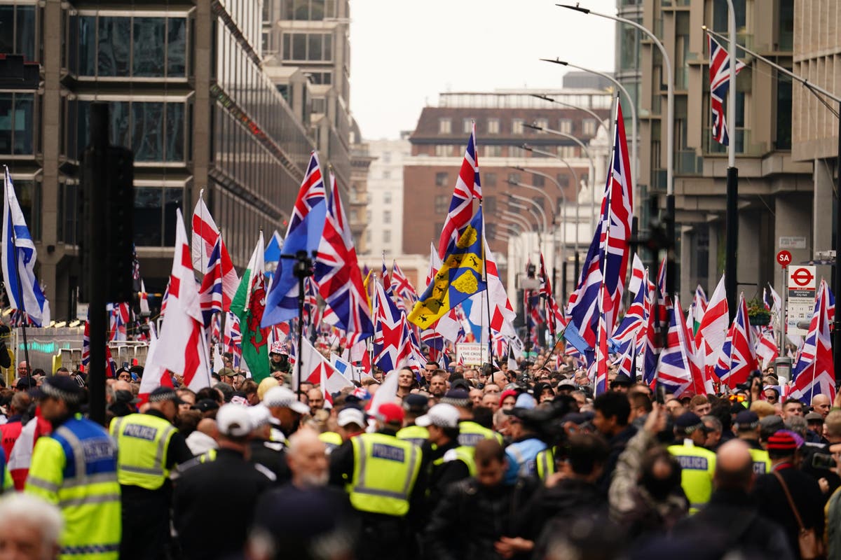 Thousands join extremist protest after Tommy Robinson charged with terror offence