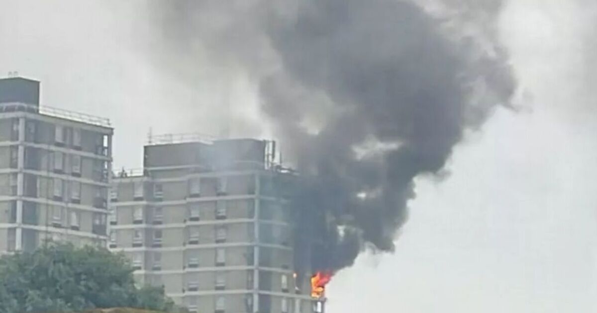 Tower block goes up in flames as 70 firefighters race to battle inferno