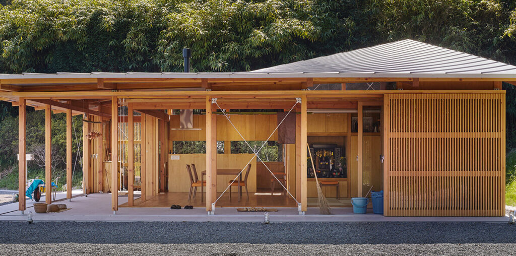 curved roof follows ridgeline of japanese mountains in weekend home by ota archistudio