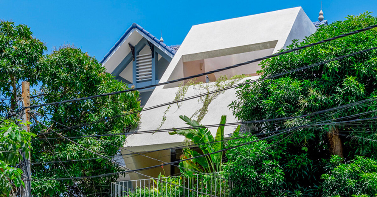 cutouts in slanted concrete roof illuminate vietnamese residence by DMA architects