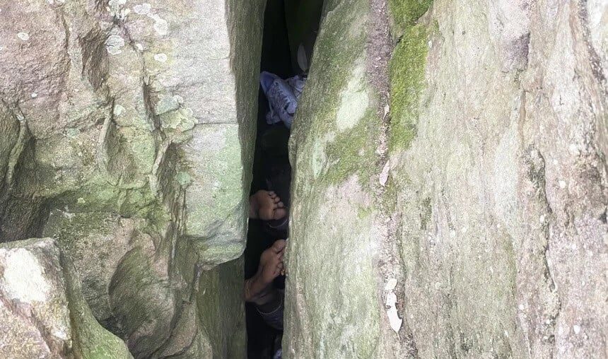 woman trapped between two rocks | Express News