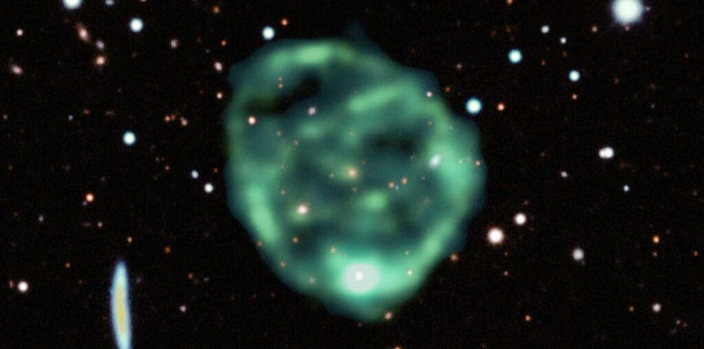 a large green circle that is partially transparent against a black background with white dots as stars