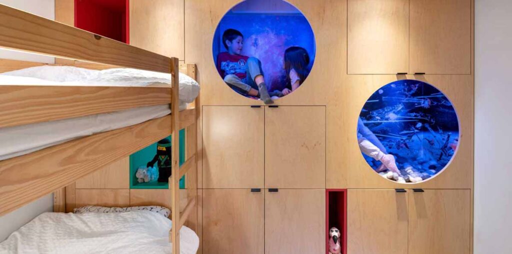 A Kid's Bedroom With Built-In Reading Nooks