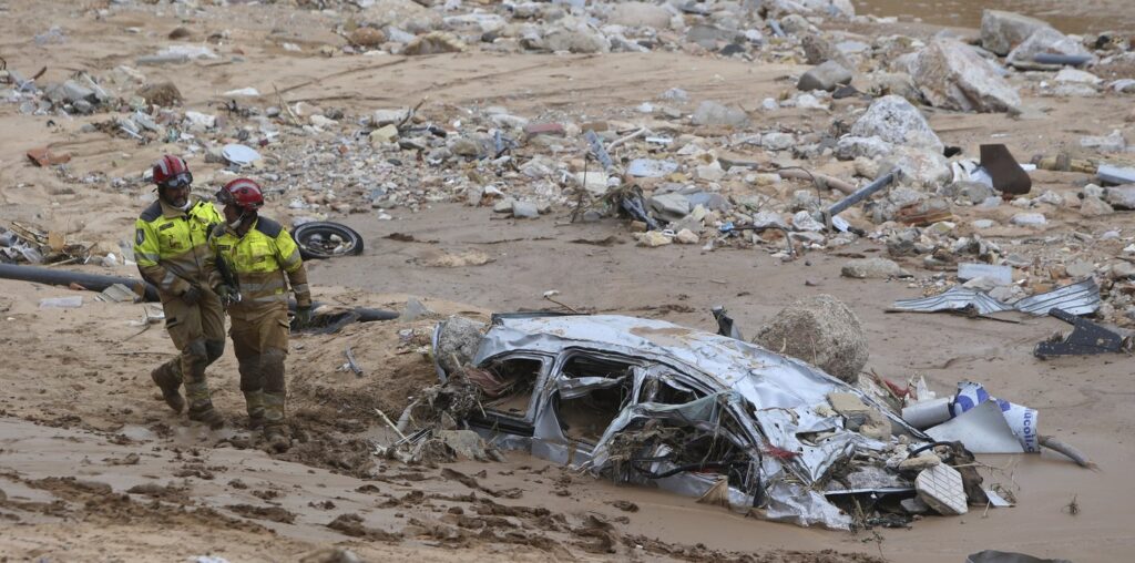 A crowd of Spain's flood survivors toss mud and shout insults at King Felipe VI