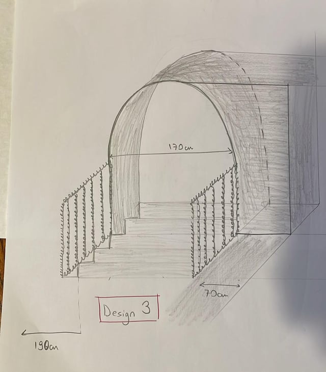 An arched doorway with stairs. Trouble of seeing one of the steps before the arch.