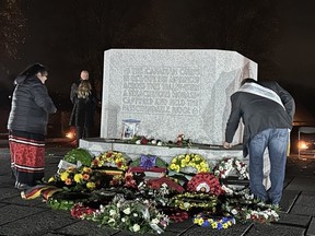 Honorary Capt. Debbie Eisan and Jeff Purdy visit the Canadian Memorial in Crest Farm, in Belgium.