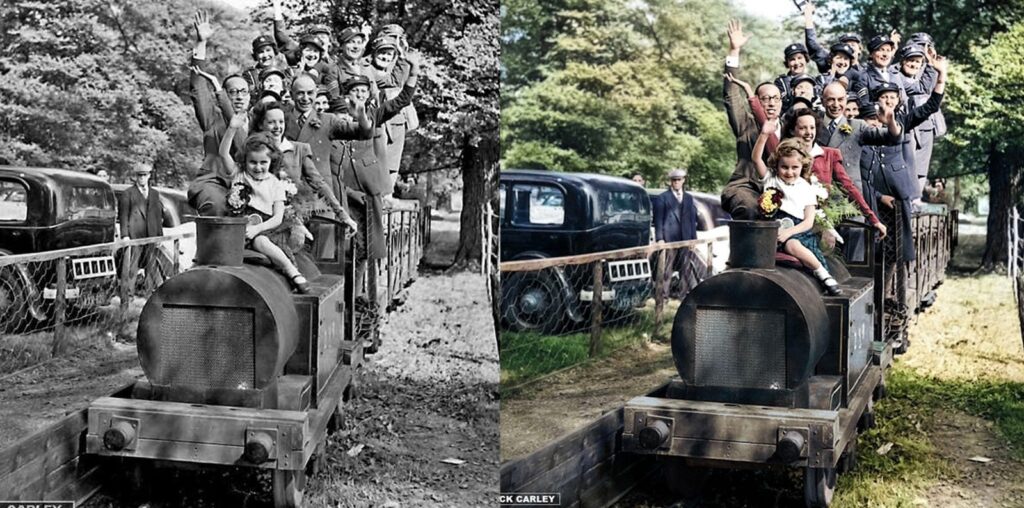 Black-and-white and colorized versions of a historical photo showing a group of people, including children, excitedly riding a small steam train outdoors. Trees and classic cars are visible in the background.