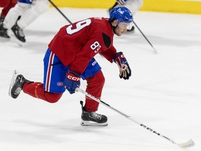 Forward Joshua Roy is seen taking part in skating drill with his stick held in his right hand dragging along the ice.