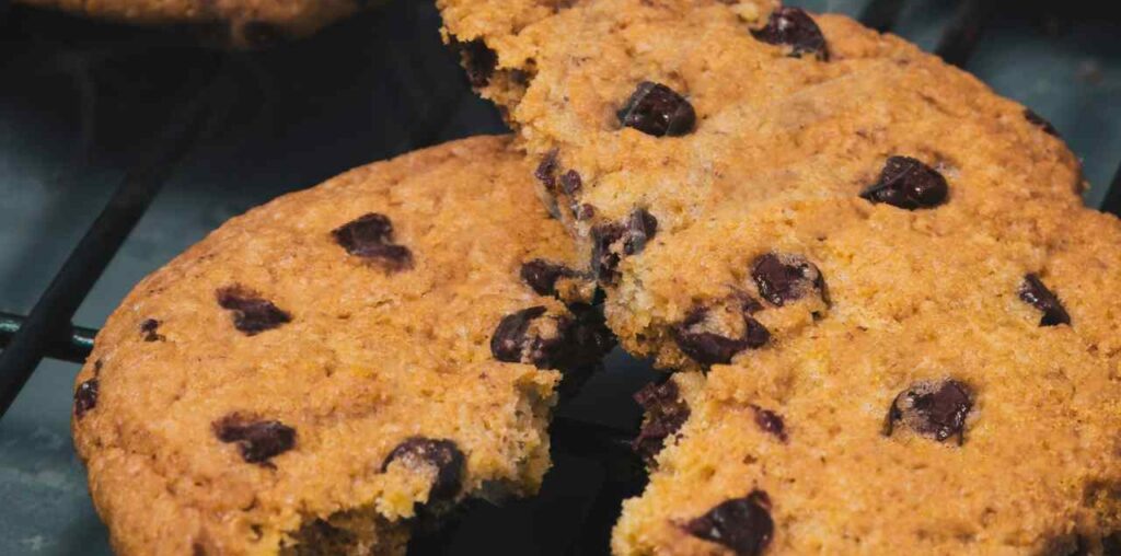 Photo of several cookies with the center one torn in half