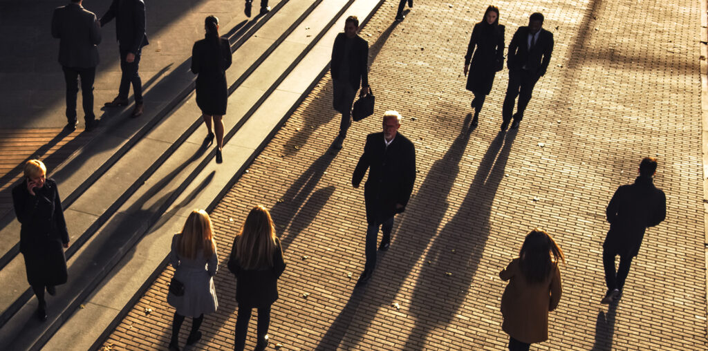 Businesspeople walking in a public area (Image: Adobe)