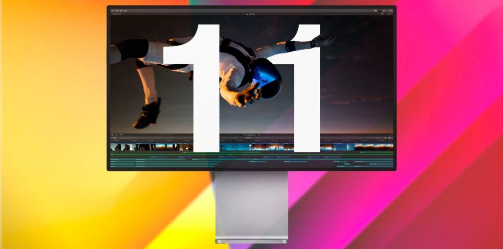 A large number "11" is displayed on a computer monitor with an image of a skydiver in the background. The colorful gradient backdrop includes shades of yellow, orange, and pink.