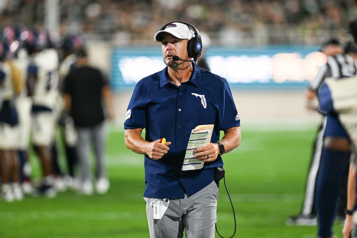 Florida Atlantic’s Tom Herman irately confronts South Florida head coach Alex Golesh after 44-21 embarrassment