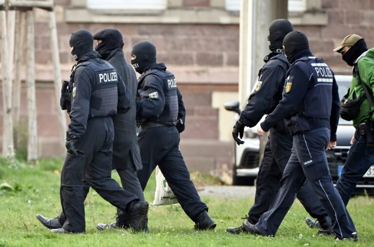 Hundreds of police in pre-dawn raids swooped on 20 locations linked to the militant group 'Saxonian Separatists' in formerly communist eastern Germany and neighbouring Poland