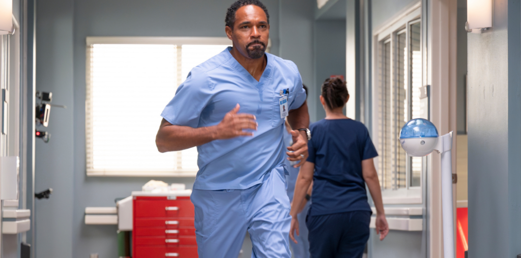 Ben Warren runs through the hospital in the lead photo for Grey