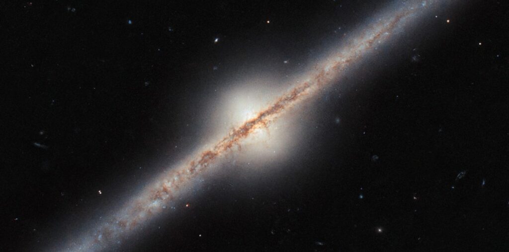 Hubble Space Telescope Captures Rare Edge-On View of a Spiral Galaxy Located Millions of Light-Years Away