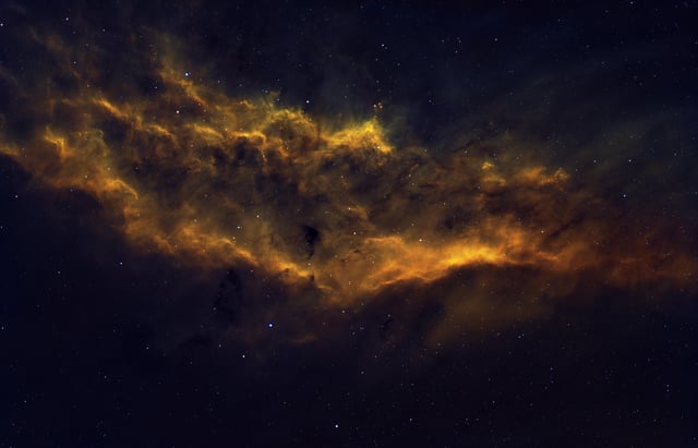 I took a picture of the California Nebula with my telescope. It looks like a sunset behind a cloud 🌥️