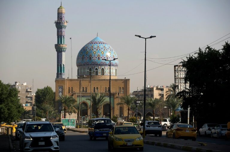 Cars drive past Baghdad's Seventeen Ramadan Mosque on November 19 ahead of Iraq's first census in nearly 40 years