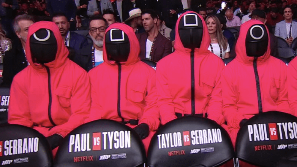 Jake Paul and Mike Tyson Fight Filled With Nonstop Netflix Promotion, From ‘Squid Game’ Guards to ‘America’s Sweethearts’ Cheerleaders