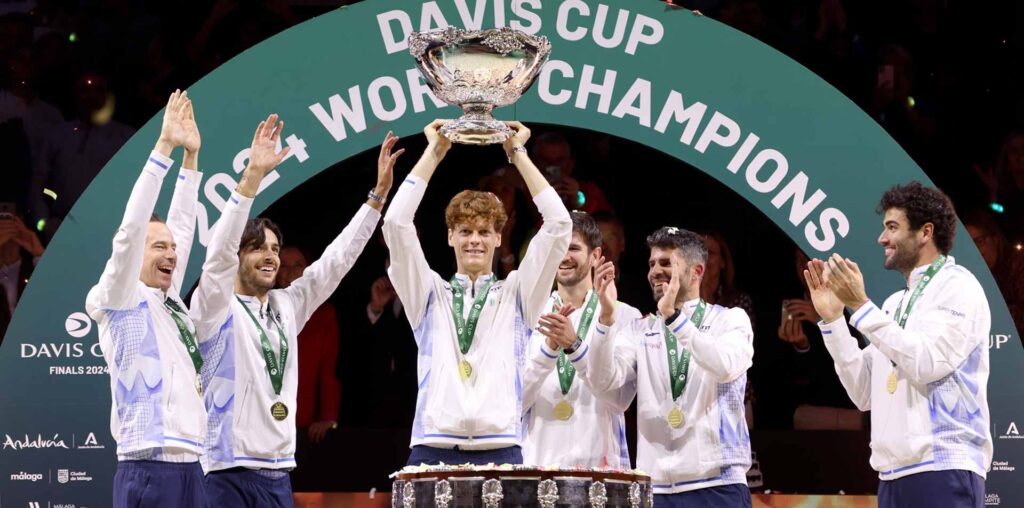 Jannik Sinner lifts the Davis Cup trophy alongside his Italian teammates on Sunday in Malaga.