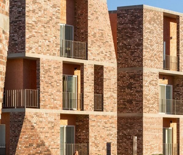 Jorge Urias designs notched brick apartment complex in Mexico