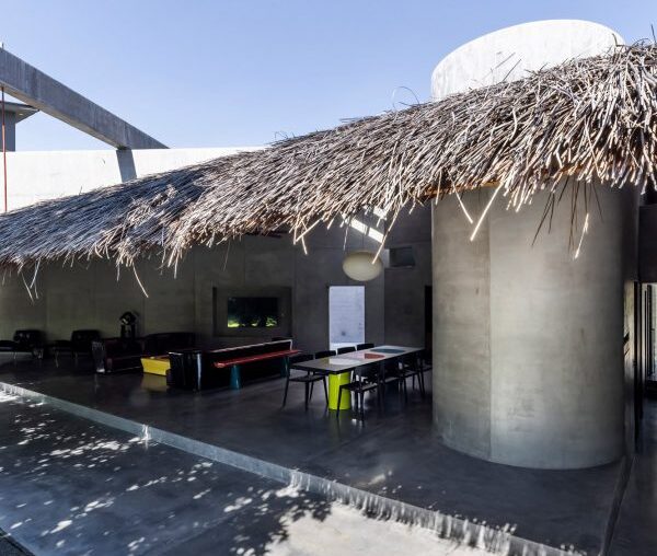 Kientruc O tops sculptural Thu House with large thatched roof in Vietnam