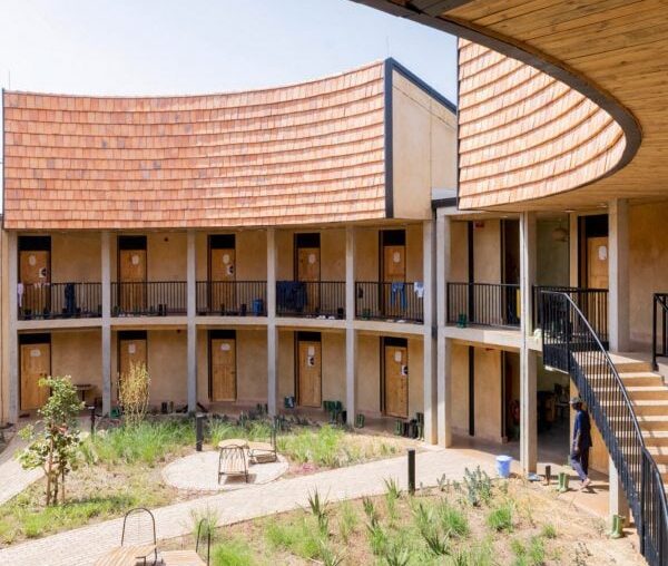 MASS Design Group uses earthen walls for Rwandan university campus