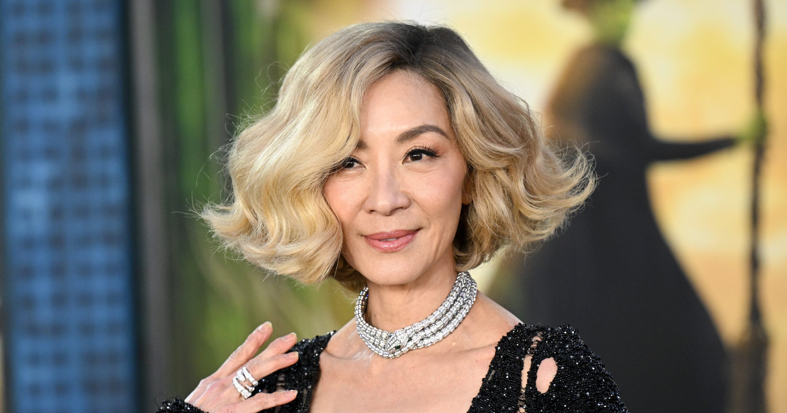 Michelle Yeoh’s New “Syrup Blond” Bob Has Fans Doing a Double Take