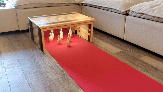 Mini bowling lane that transforms into a coffee table