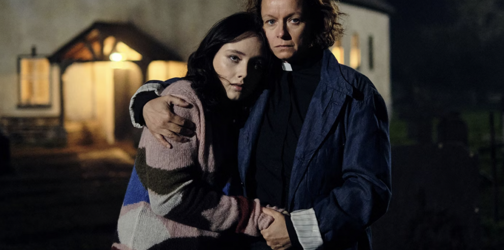 Samantha Morton and Ruby Stokes embrace and look scared in The Burning Girls